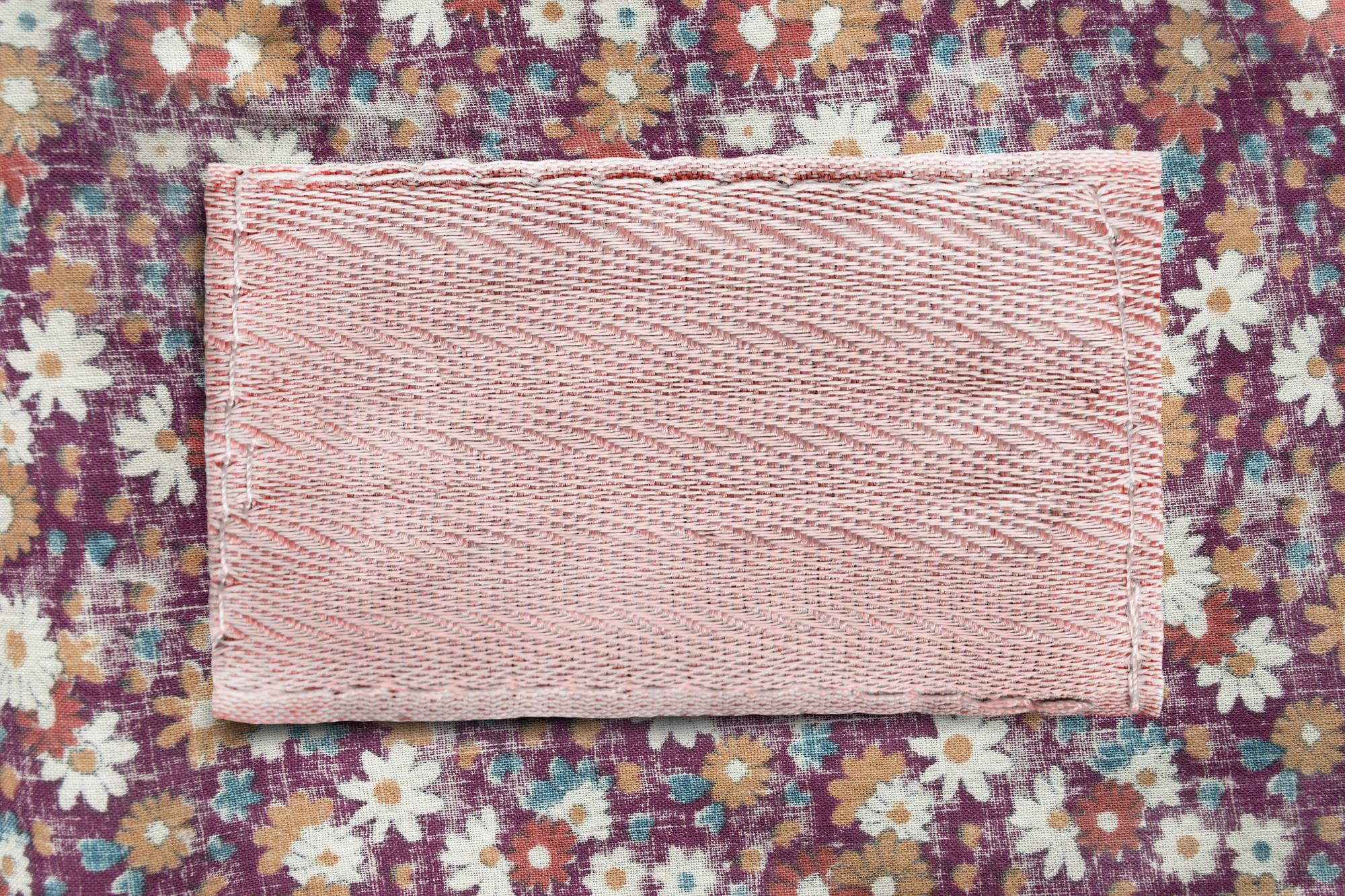 Stack of embroidered patches on craft paper